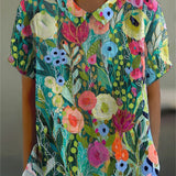 Xenia | Blusa con fantasia floreale ad acquerello