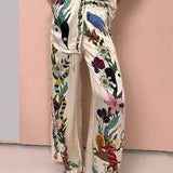 Selma | Set blusa e pantaloni in raso con stampa unica, stile resort