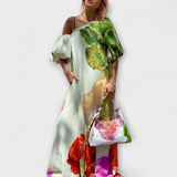 Amelie | Maxi abito con stampa floreale con colletto inclinato e maniche a sbuffo — 1