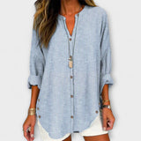 Kerstin | Elegante top con scollo a V e classico motivo a righe — 1