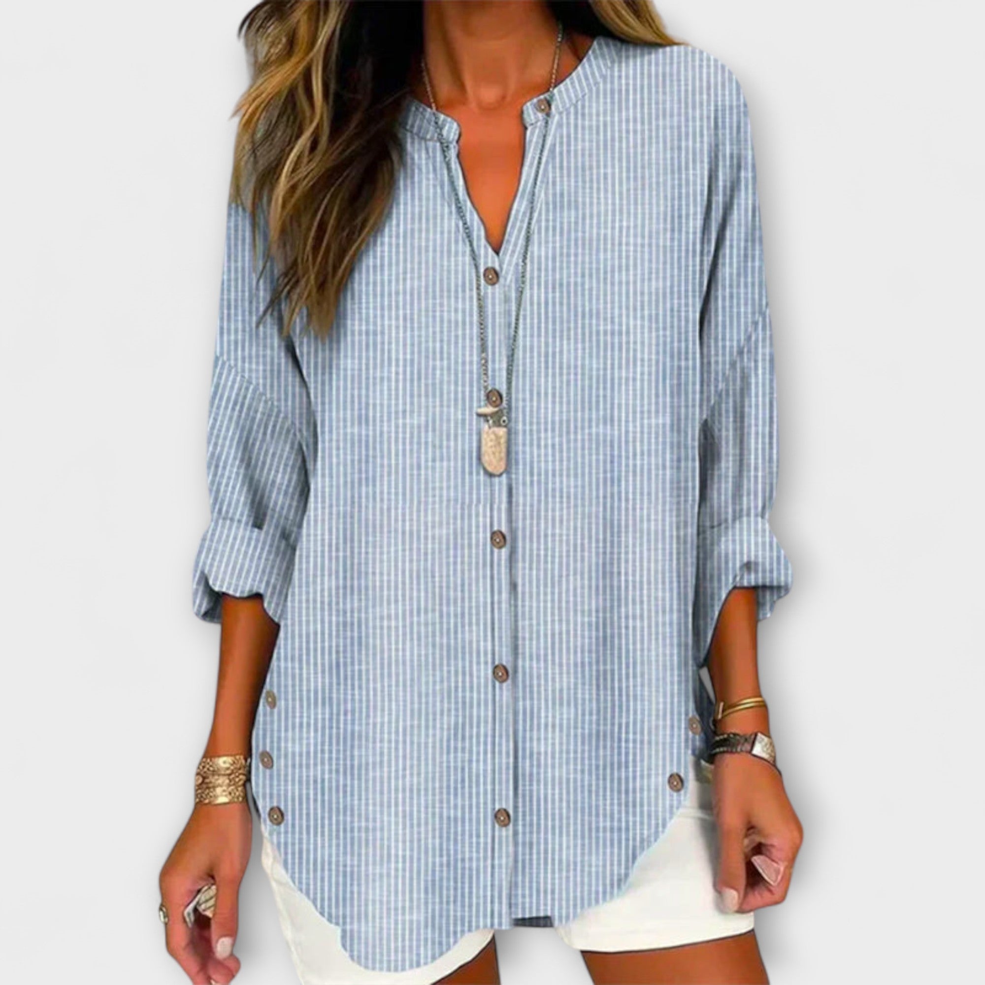 Kerstin | Elegante top con scollo a V e classico motivo a righe — 1