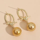 Rebekka | Orecchini a cerchio con perle color oro — 1