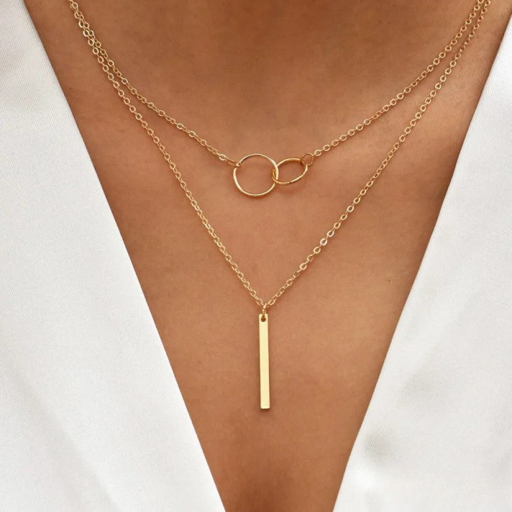 Linda | Collana retrò color oro con pendente a doppio cerchio — 1