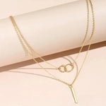 Linda | Collana retrò color oro con pendente a doppio cerchio — 3
